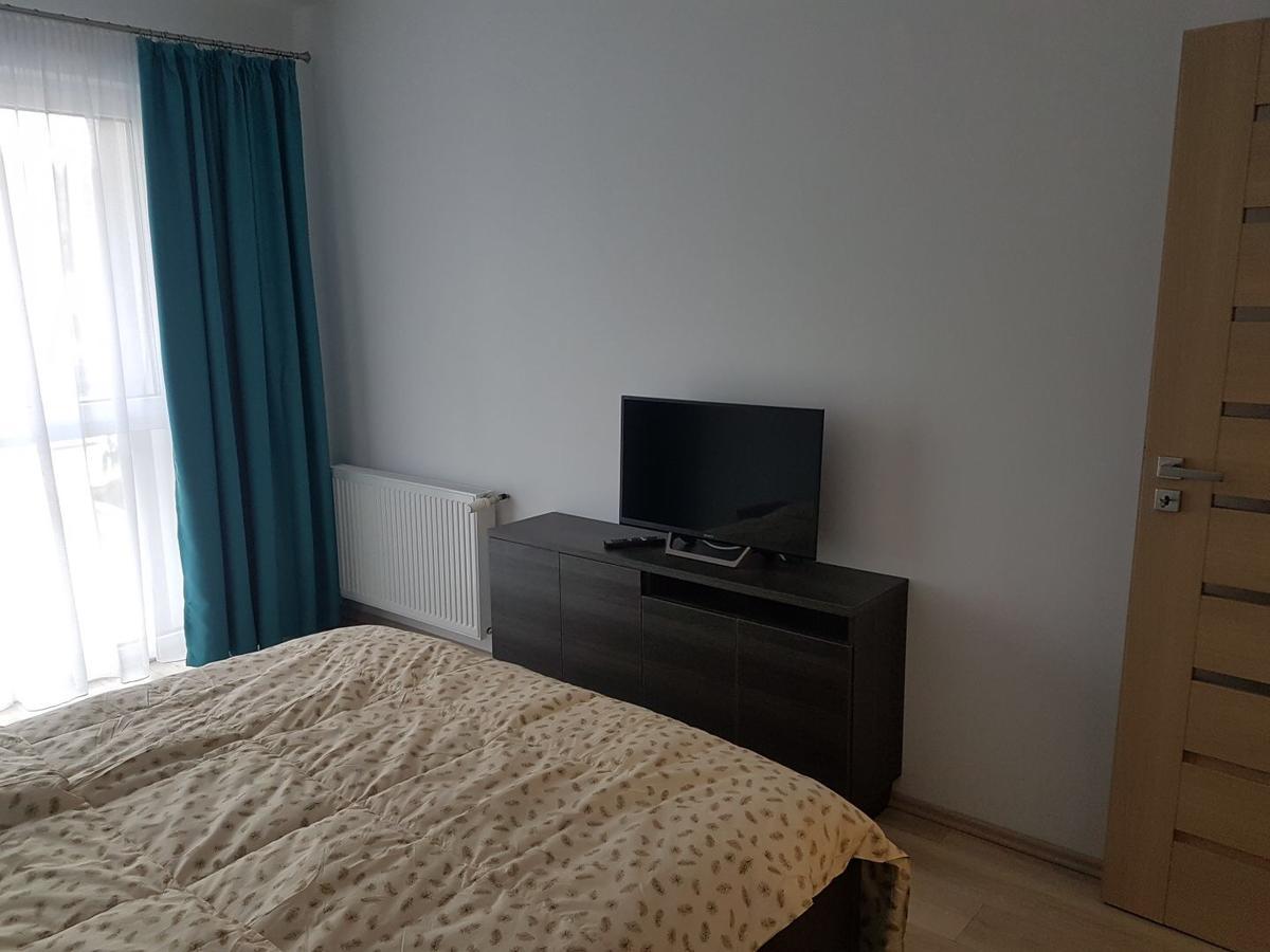 Hotel Platinia Kluž Exteriér fotografie A bedroom with a television